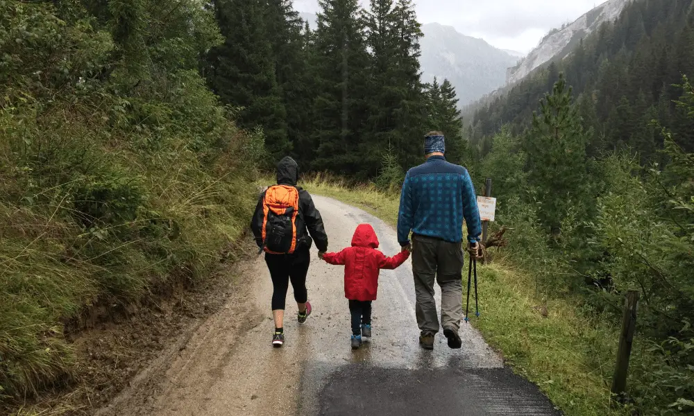 Family taking a hike together in the mountains. 