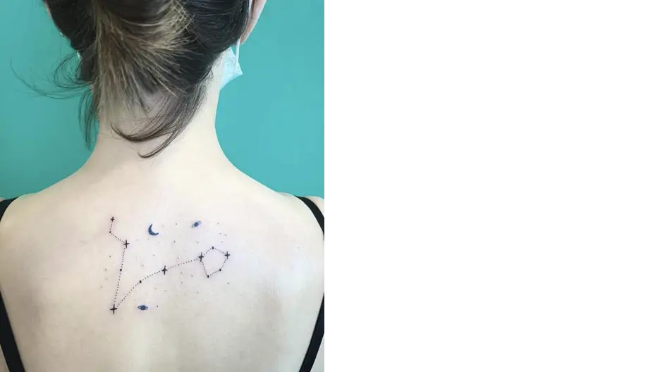 tattoo of stars and moon on womans back