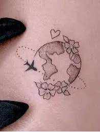 tattoo of plane flying around moon